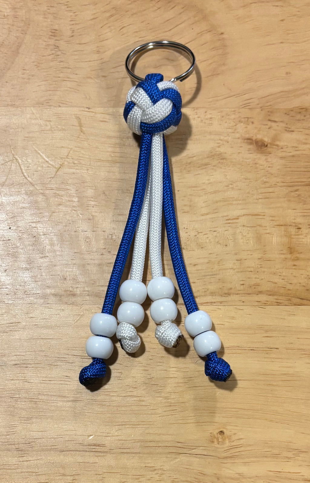Blue and white keychain with matching card grabber/roach clip.