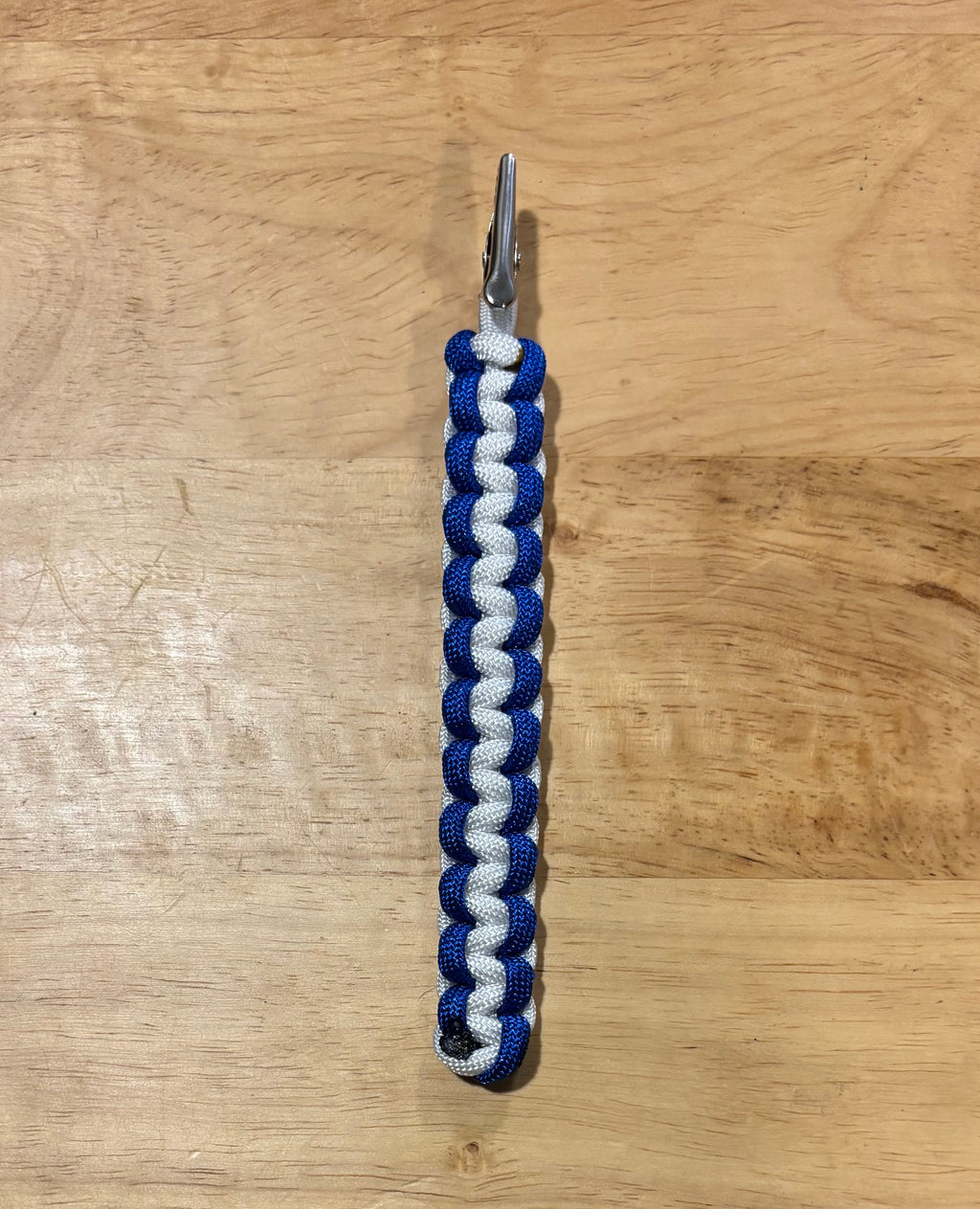 Blue and white keychain with matching card grabber/roach clip.