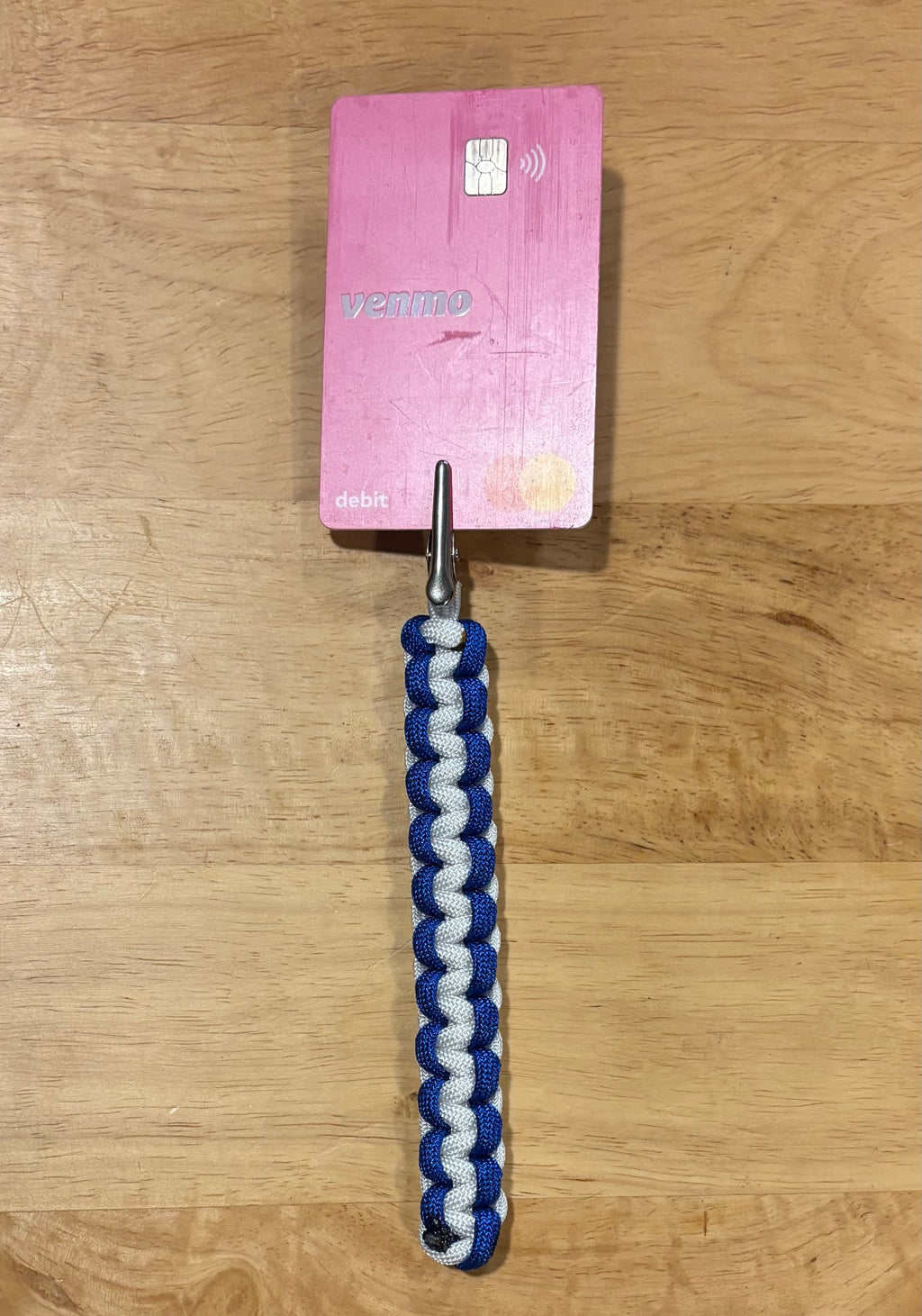 Blue and white keychain with matching card grabber/roach clip.