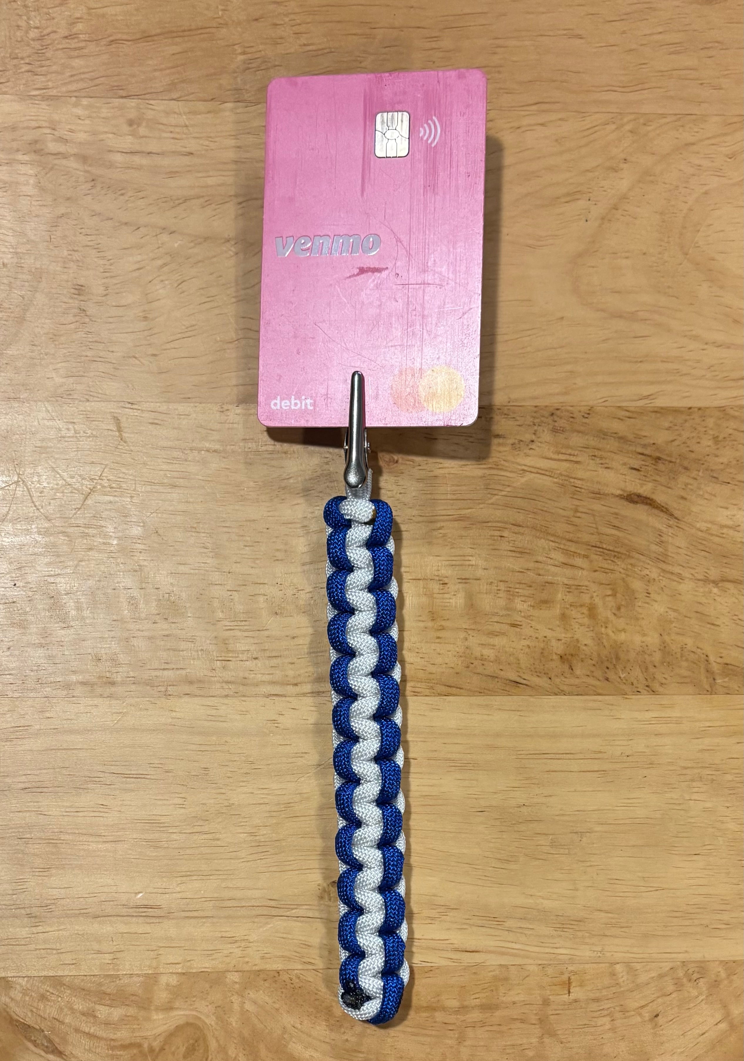 Blue and white keychain with matching card grabber/roach clip.