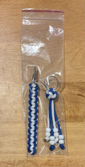 Blue and white keychain with matching card grabber/roach clip.